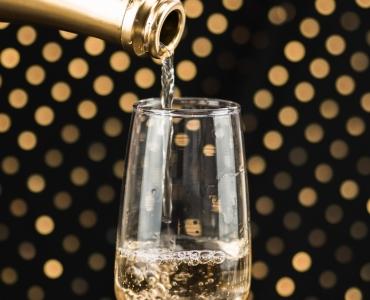 close-up-champagne-bottle-pouring-glass.jpg